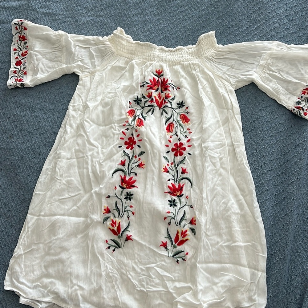 White flowy dress with floral embroidery